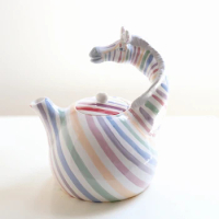 Rainbow zebra ceramic kettle creative design decorative colorful stripes.