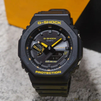 【CASIO 卡西歐】G-SHOCK 八角 農家橡樹 黑黃配色系列 雙顯手錶 畢業禮物(GA-B2100CY-1A)
