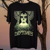May include Black t- shirt featuring a Day of the Dead- style graphic of a woman with skull face pai