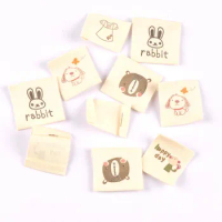 50pcs Beige Cotton Woven Labels For Sewing Accessories Label Cartoon Animal Shoes Bags Washable Garment Fabric Tags Care C2181