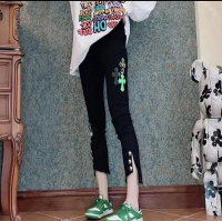 歐洲站秋新款黑色時尚斜開叉個性十字架標顯瘦直筒牛仔褲女潮