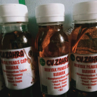Minyak tradisional Karo Panas Cap Biawak