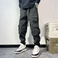 New Spring Men's Jeans Multi-Pocket Tooling Pants Korean Version Tied Ankle Harem Pants Black Samurai Hip-hop Casual Pants штаны