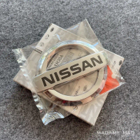 แท้ศูนย์ 💯% โลโก้ กระจังหน้า Nissan March 2010-2014 ขนาด 11.3x9.5cm (UCU-62890-1HJ0A)