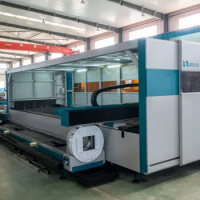 6000W High power fiber laser cutting machine with exchange table and full protective cover high quality and pipe cutting device