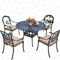 round outdoor dining table set with four dining chairs