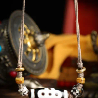 Tibetan 9-eye DZI that brings good luck to the wearer and his family