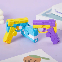Fingertip Gyro Gun Rotating Carrot Gun 3D Gravity Mini Gravity Small Pistol Automatic Reloading Children's Reward Gift Toy