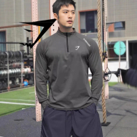 GYMSHARK เสื้อยืดออกกำลังกายสำหรับผู้ชาย แขนยาวซิปครึ่งตัว ลายฉลามฟิตเนส