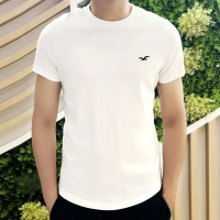 เสื้อยืดผู้ชาย Hollister คอกลม แขนสั้น ผ้าฝ้ายพรีเมียม 100% ทรงหลวมพิมพ์ลายนกทะเล เสื้อผ้าลำลองทรงหล