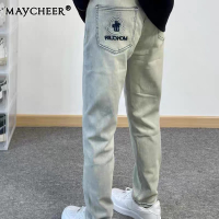MAYCHEER กางเกงแจ็คเก็ตยีนส์ขาดชายตรงเข้ารูปพอดีกางเกงยีนส์ลำลองแสงวินเทจ