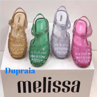 Melissa รองเท้าผู้หญิง 2024 รองเท้าแตะผู้หญิง Melissa ใหม่ปิดหัวรองเท้าเจลลี่กลวงรองเท้าชายหาดโรมันแบน ~