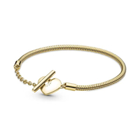 สร้อยข้อมือ Snake chain 14 gold-plated T-bar heart bracelet สีทอง