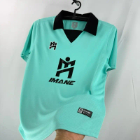 IMANE เสื้อกีฬาคอสีปก พร้อมโลโก้ M (IMANE )กลางตัว IMA1 002 ของแท้ 100%