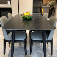 The rock-paneled dining table marble dining table chairs are combined with solid wood dining table chairs