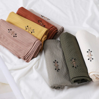 Striped pleated hijab with rhinestone embellishments for Hari Raya, weddings, and Ramadan; suitable 