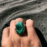 Cincin batu bulu merak