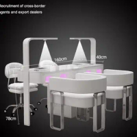 A manicure table and chair set with a second-generation vacuum cleaner and red light grill